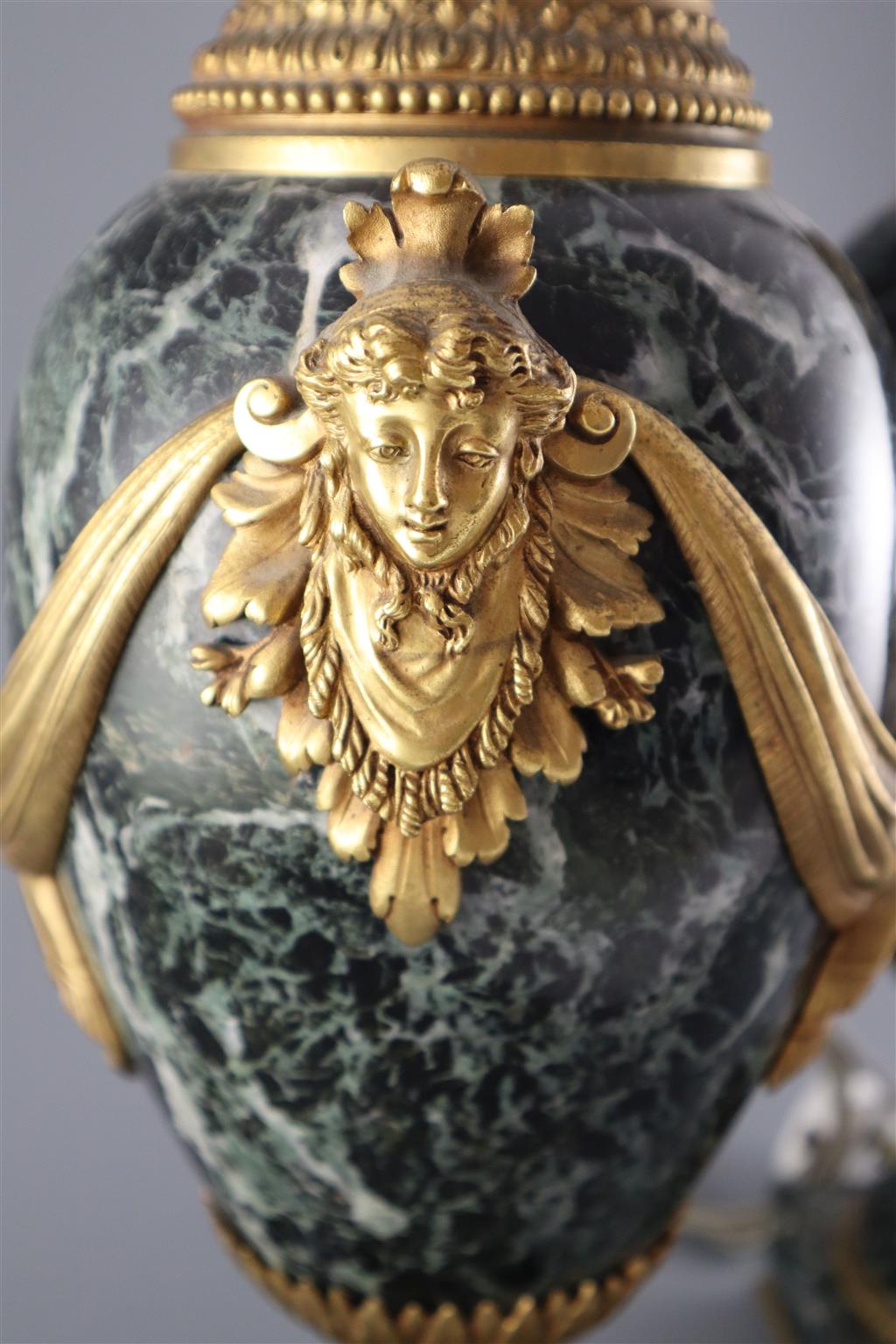 A pair of early 20th century ormolu green marble table lamps, overall height 20in.